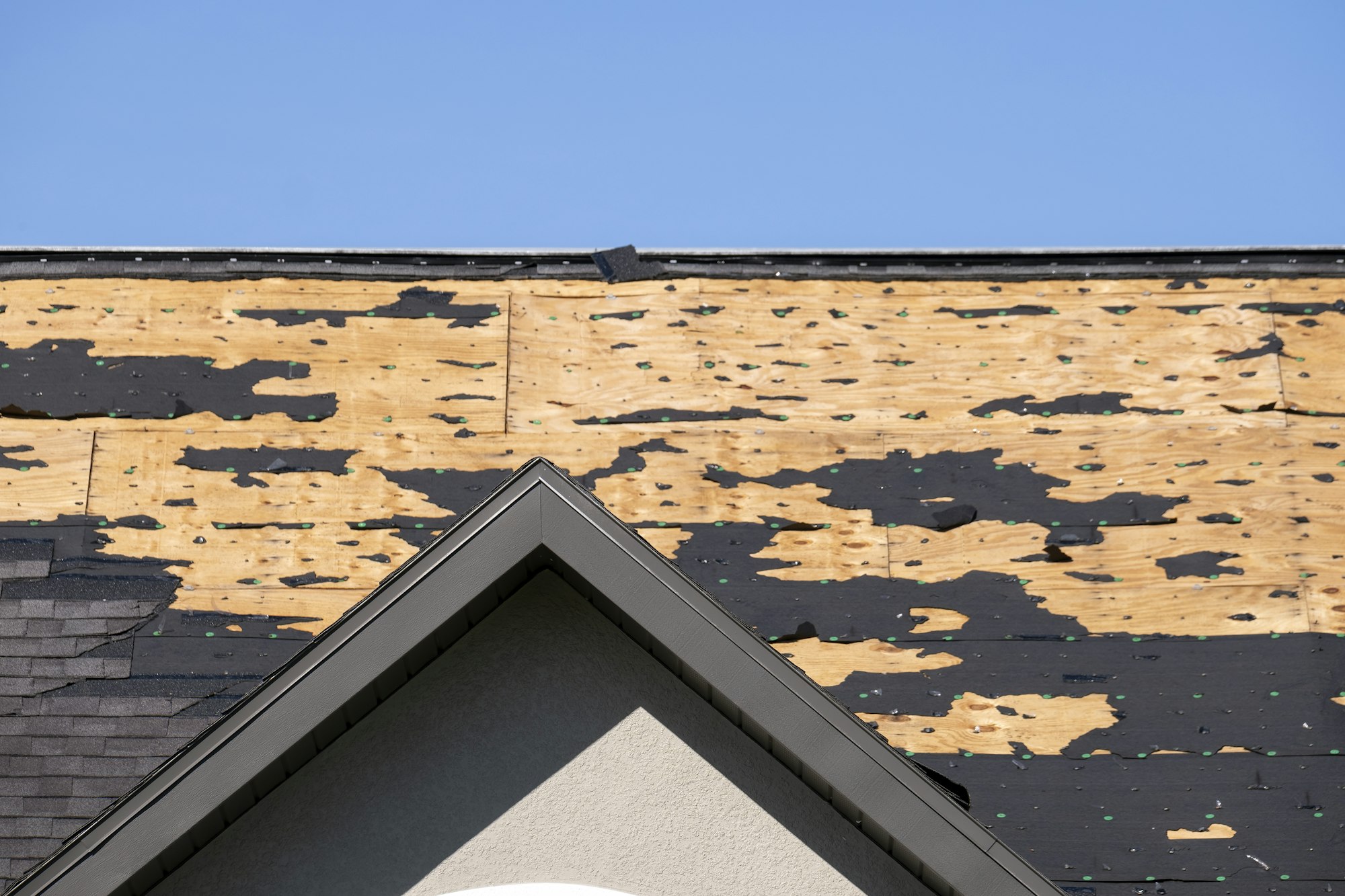 Natural disaster and its consequences. Hurricane Ian destroyed house roof in Florida